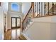 Grand entryway with hardwood floors, elegant staircase, and large windows at 3327 High Noontide Way, Acworth, GA 30101