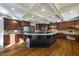 Island kitchen with dark cabinetry and granite countertops at 3327 High Noontide Way, Acworth, GA 30101