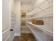 Walk-in pantry with ample shelving for storage at 3327 High Noontide Way, Acworth, GA 30101