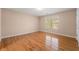 Bright bedroom with hardwood floors and a large window at 3853 Cohutta Pass, Marietta, GA 30062