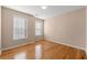 Simple bedroom with hardwood floors and neutral walls at 3853 Cohutta Pass, Marietta, GA 30062