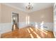 Bright dining room with hardwood floors and wainscoting at 3853 Cohutta Pass, Marietta, GA 30062