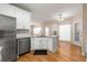 Modern kitchen with white cabinets and granite countertops at 3853 Cohutta Pass, Marietta, GA 30062