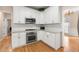 Modern kitchen with stainless steel appliances and white cabinets at 3853 Cohutta Pass, Marietta, GA 30062