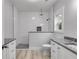 Bathroom with walk-in shower, granite vanity and window at 410 N Carroll N St, Bowdon, GA 30108