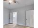 Bedroom with ceiling fan, walk-in closet, and wood-look floors at 410 N Carroll N St, Bowdon, GA 30108