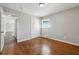 Hardwood floor bedroom with access to another room at 8586 Taylor Rd, Riverdale, GA 30274