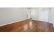 Spacious bedroom with hardwood floors and access to bathroom at 8586 Taylor Rd, Riverdale, GA 30274