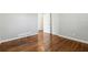 Hardwood floors and a spacious layout in this bright bedroom at 8586 Taylor Rd, Riverdale, GA 30274