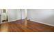 Spacious bedroom with hardwood floors and access to bathroom at 8586 Taylor Rd, Riverdale, GA 30274