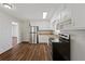 Bright kitchen with stainless steel appliances and wood-look floors at 8586 Taylor Rd, Riverdale, GA 30274