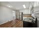 Bright kitchen with stainless steel appliances and wood-look floors at 8586 Taylor Rd, Riverdale, GA 30274