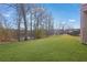 Landscaped backyard with lush green grass and lake view at 1586 Highway 11 N, Social Circle, GA 30025