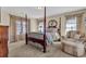 Bedroom with a four-poster bed and sitting area at 1586 Highway 11 N, Social Circle, GA 30025