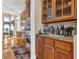 Butlers pantry with wet bar and glass-front cabinets at 1586 Highway 11 N, Social Circle, GA 30025