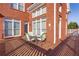Brick home with a deck and seating area, great for outdoor entertaining at 1586 Highway 11 N, Social Circle, GA 30025