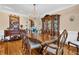 Elegant dining room features hardwood floors and a chandelier at 1586 Highway 11 N, Social Circle, GA 30025