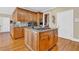 Island kitchen with granite countertops and wood cabinets at 1586 Highway 11 N, Social Circle, GA 30025