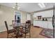 Cozy kitchen with white cabinets and breakfast nook at 1586 Highway 11 N, Social Circle, GA 30025