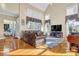 Spacious living room with hardwood floors, high ceilings, and large windows at 1586 Highway 11 N, Social Circle, GA 30025