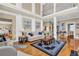 High-ceilinged living room with hardwood floors and fireplace at 1586 Highway 11 N, Social Circle, GA 30025