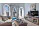Comfortable living room with large windows, a couch, and a TV at 1586 Highway 11 N, Social Circle, GA 30025