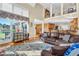Sunlit living room features hardwood floors and a view into the kitchen at 1586 Highway 11 N, Social Circle, GA 30025