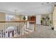 Spacious upper hallway with chandelier and views to entry below at 1586 Highway 11 N, Social Circle, GA 30025