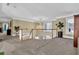 Bright upper hallway with chandelier and views to entry below at 1586 Highway 11 N, Social Circle, GA 30025