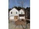 Two-story house under construction, featuring a white exterior and a two-car garage at 2615 Virginia Cv, Riverdale, GA 30296