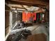 Unfinished garage interior with exposed framing and debris at 2615 Virginia Cv, Riverdale, GA 30296