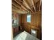Unfinished interior, showing a wall with a window and exposed framing at 2615 Virginia Cv, Riverdale, GA 30296