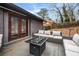 Private backyard patio with seating area and French doors at 2725 Shoreland Sw Dr, Atlanta, GA 30331