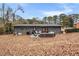 House exterior showcasing a large backyard patio at 2725 Shoreland Sw Dr, Atlanta, GA 30331