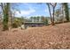 Expansive backyard with fire pit and wooded backdrop at 2725 Shoreland Sw Dr, Atlanta, GA 30331