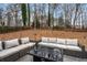 Relaxing backyard patio with sectional sofa and fire pit at 2725 Shoreland Sw Dr, Atlanta, GA 30331