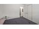 Cozy bedroom with double doors and glass top accent table at 2725 Shoreland Sw Dr, Atlanta, GA 30331