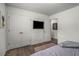 Spacious bedroom with large closets and mounted TV at 2725 Shoreland Sw Dr, Atlanta, GA 30331