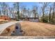 View of the home from the street with well-maintained landscaping and mailbox at 2725 Shoreland Sw Dr, Atlanta, GA 30331