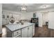 Modern kitchen with granite island, stainless steel appliances, and hardwood floors at 2725 Shoreland Sw Dr, Atlanta, GA 30331