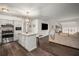 Open-concept kitchen with a center island and stainless steel appliances flows into the adjacent living area at 2725 Shoreland Sw Dr, Atlanta, GA 30331