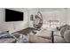 Cozy living room with comfortable sectional sofa, egg chair, and ample natural light at 2725 Shoreland Sw Dr, Atlanta, GA 30331