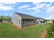 Home featuring a well-maintained lawn, and a covered patio, providing ample space for outdoor enjoyment at 44 Easton Park Blvd, Dallas, GA 30157