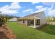 Home featuring a well-maintained lawn and a covered patio, perfect for relaxing or entertaining guests at 44 Easton Park Blvd, Dallas, GA 30157