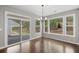 Bright dining area with large windows, a sliding glass door, and hardwood floors at 44 Easton Park Blvd, Dallas, GA 30157