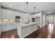 Modern kitchen with an island, white cabinets, stainless steel appliances, and hardwood floors at 44 Easton Park Blvd, Dallas, GA 30157