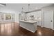 Open-concept kitchen features an island, stainless steel appliances, and hardwood floors at 44 Easton Park Blvd, Dallas, GA 30157
