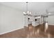 Open-concept living room with hardwood floors and a view of the kitchen and entrance at 44 Easton Park Blvd, Dallas, GA 30157