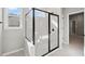 Modern shower with a glass enclosure and marble tile at 44 Easton Park Blvd, Dallas, GA 30157