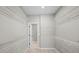 Spacious walk-in closet with white wire shelving on all walls and neutral carpeting at 44 Easton Park Blvd, Dallas, GA 30157